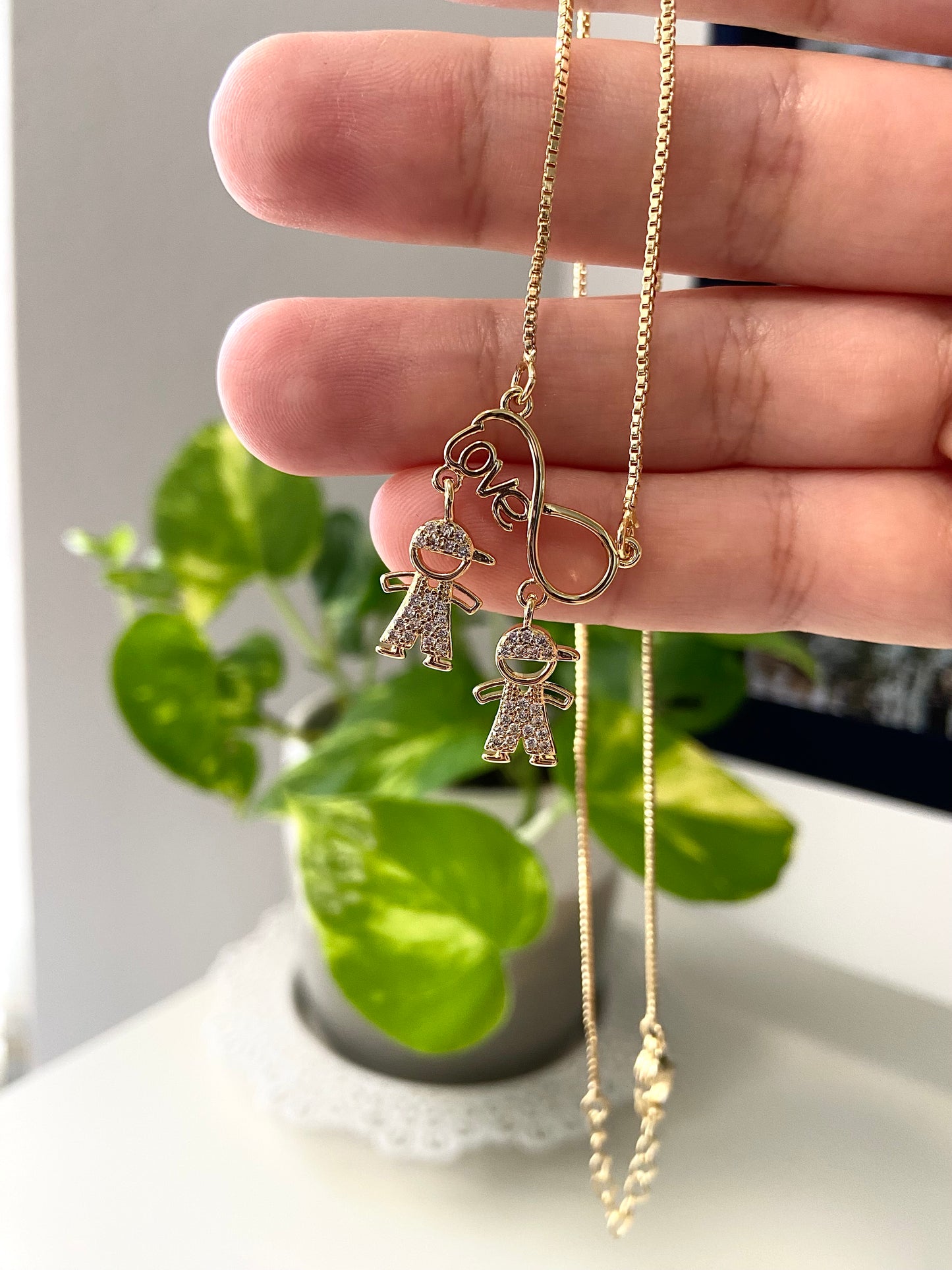 Gold Infinity Necklace with Two Boys
